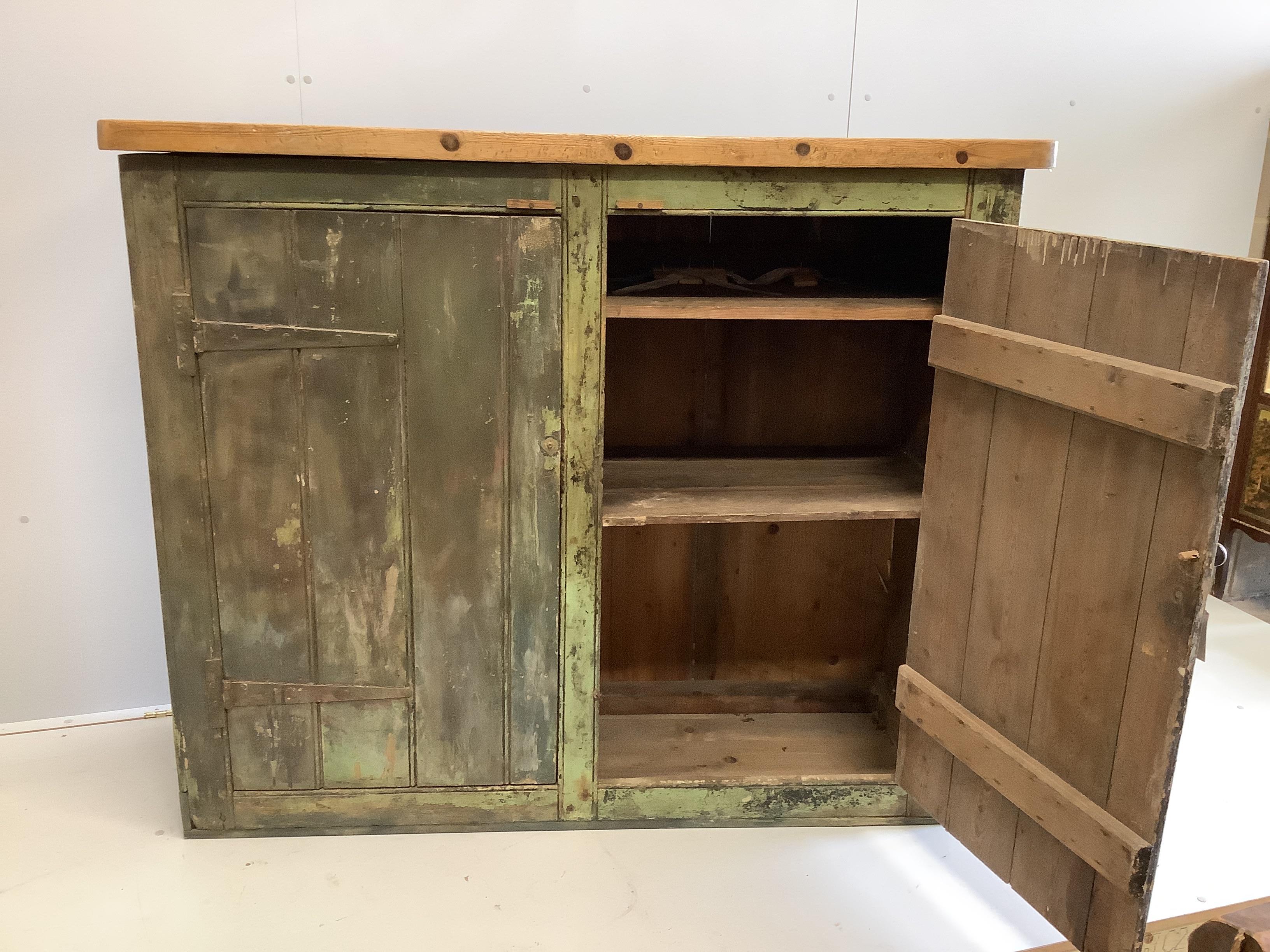 A provincial painted pine two door side cabinet, width 147cm, depth 52cm, height 124cm